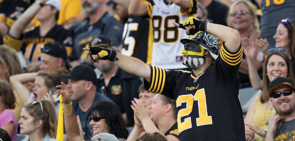 GVL/Kevin Sielaff - Fans celebrate a Tiger-Cats interception. The Hamilton Tiger-Cats square off against the Saskatchewan Roughriders Saturday, August 20, 2016 in Hamilton, Ontario. 