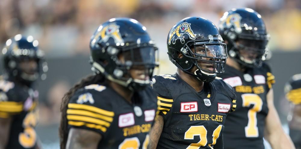 GVL/Kevin Sielaff - Simoni Lawrence (21) returns to the sideline after the Roughriders turn the ball over on downs. The Hamilton Tiger-Cats square off against the Saskatchewan Roughriders Saturday, August 20, 2016 in Hamilton, Ontario. 