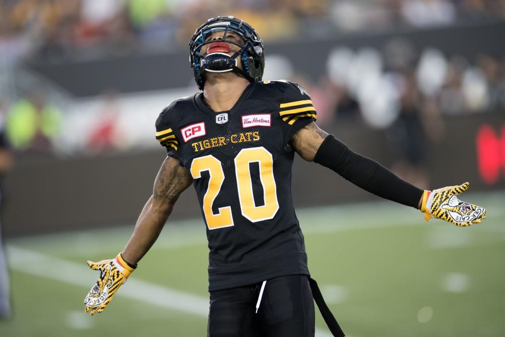 GVL/Kevin Sielaff - Emmanuel Davis (20) celebrates the Tiger-Cats' imminent victory. The Hamilton Tiger-Cats square off against the Saskatchewan Roughriders Saturday, August 20, 2016 in Hamilton, Ontario. 