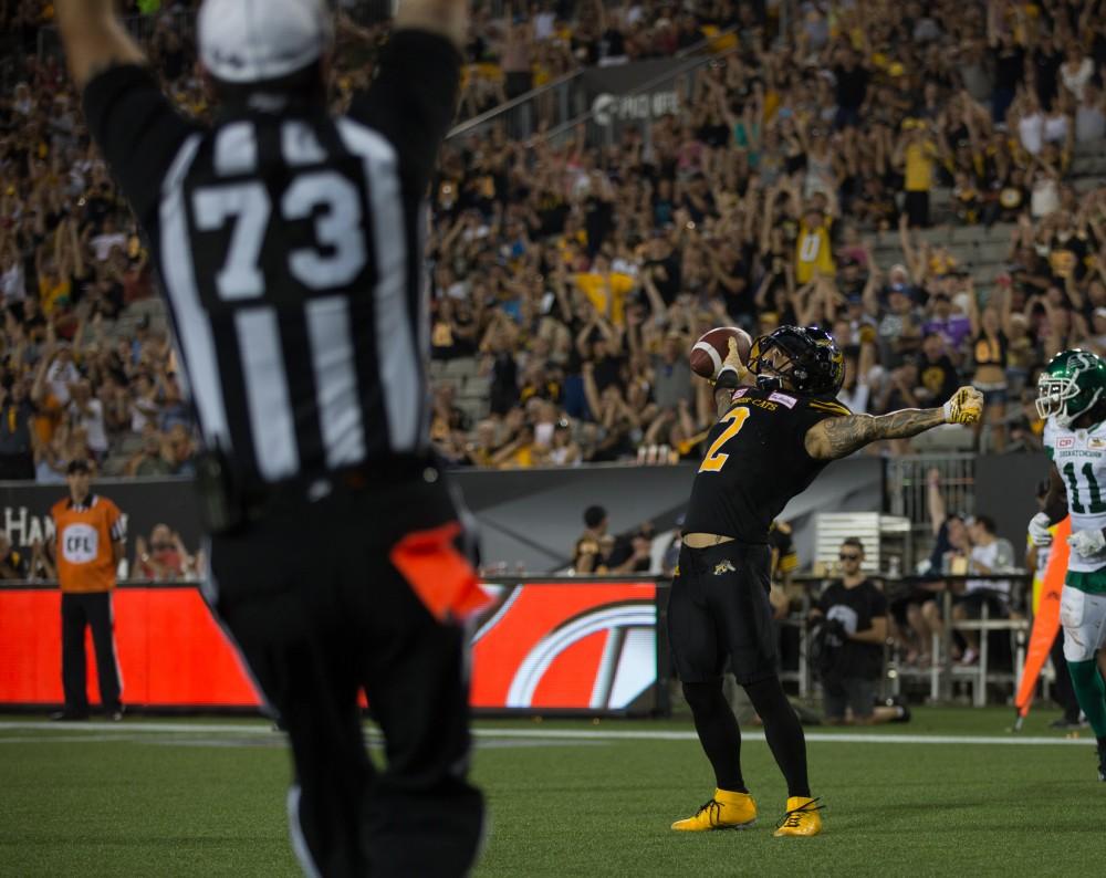 GVL/Kevin Sielaff - Chad Owens (2) celebrates a wide open touchdown reception. The Hamilton Tiger-Cats square off against the Saskatchewan Roughriders Saturday, August 20, 2016 in Hamilton, Ontario. 