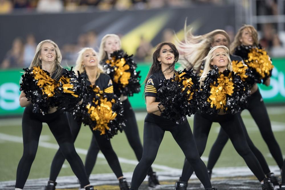 GVL/Kevin Sielaff - The Tiger-Cat cheerleaders take the field in between plays. The Hamilton Tiger-Cats square off against the Saskatchewan Roughriders Saturday, August 20, 2016 in Hamilton, Ontario. 