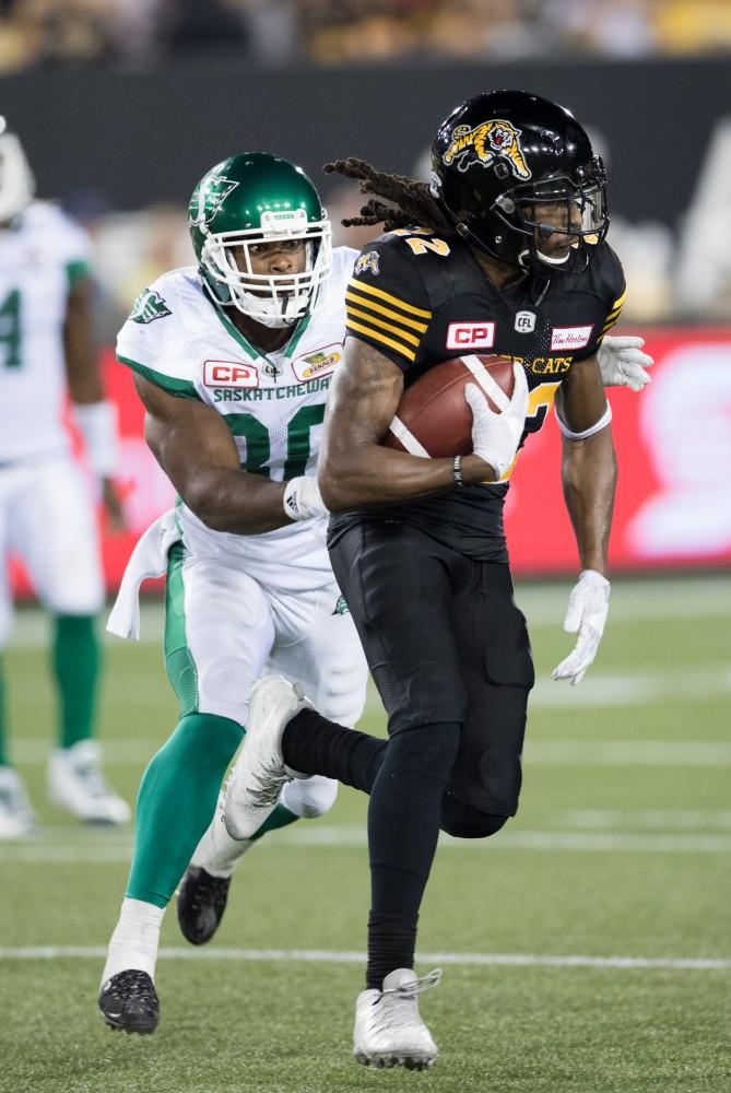 GVL/Kevin Sielaff - Courtney Stephen (22) intercepts a pass from Roughriders QB Darien Durant (4) and runs it back down the field. The Hamilton Tiger-Cats square off against the Saskatchewan Roughriders Saturday, August 20, 2016 in Hamilton, Ontario. 