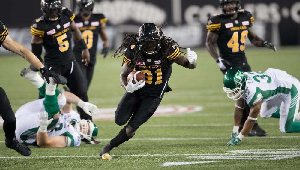 GVL/Kevin Sielaff - Dominique Ellis (31) jukes his way down field after breaking two tackles. The Hamilton Tiger-Cats square off against the Saskatchewan Roughriders Saturday, August 20, 2016 in Hamilton, Ontario. 