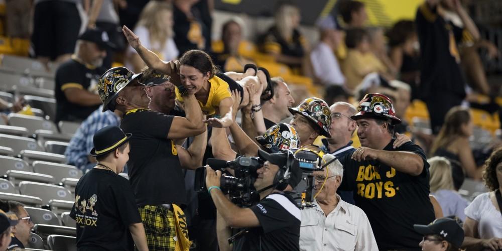 GVL/Kevin Sielaff - Fans crowd-surf to celebrate the Tiger-Cats' victory. The Hamilton Tiger-Cats square off against the Saskatchewan Roughriders Saturday, August 20, 2016 in Hamilton, Ontario. 