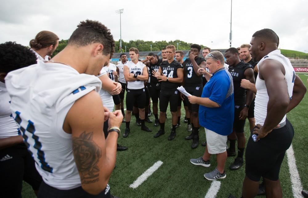 GVL / Kevin Sielaff - Associate Director of Athletics Tim Nott directs the football team to various locations on the field. Grand Valley State football hosts its annual media day at Lubbers Stadium on Thursday, August 25, 2016. 