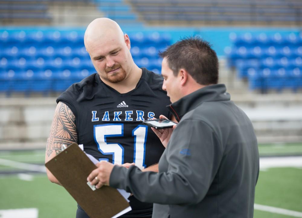 GVL / Kevin Sielaff - Aaron Cox (51) fields questions from reporters. Grand Valley State football hosts its annual media day at Lubbers Stadium on Thursday, August 25, 2016. 