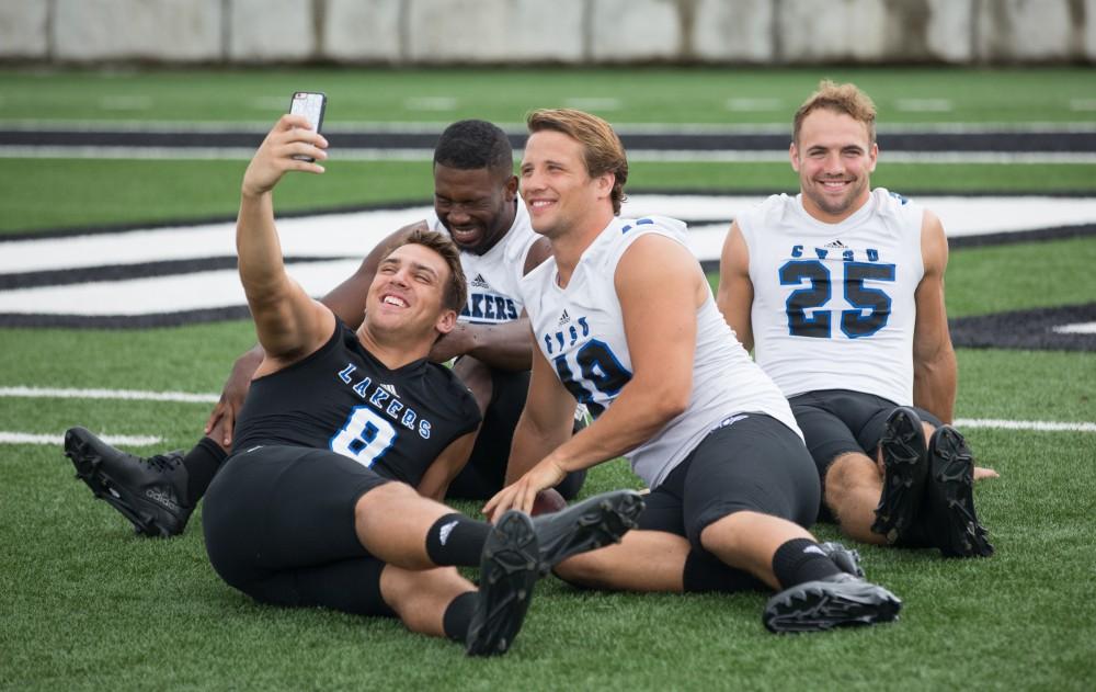 GVL / Kevin Sielaff - Joe Robbins (8) and company pose for a photo for Snapchat. Grand Valley State football hosts its annual media day at Lubbers Stadium on Thursday, August 25, 2016. 