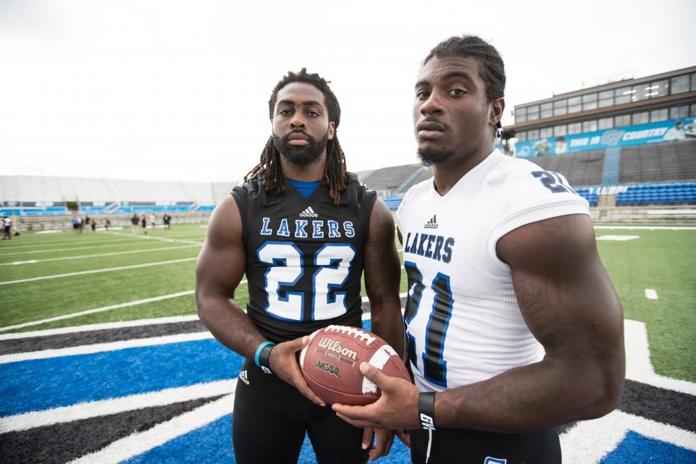 GVL / Kevin Sielaff - RB Terrell Dorsey (22) and RB Marty Carter (21) pose for a photo at the center of Lubbers Stadium. Grand Valley State football hosts its annual media day at Lubbers Stadium on Thursday, August 25, 2016. 