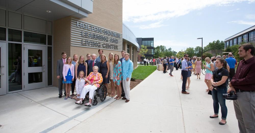 GVL/Kevin Sielaff - GVL/Kevin Sielaff - The Hooker family stands in front of the Holton-Hooker Learning and Living Center on Friday, August 26, 2016.   