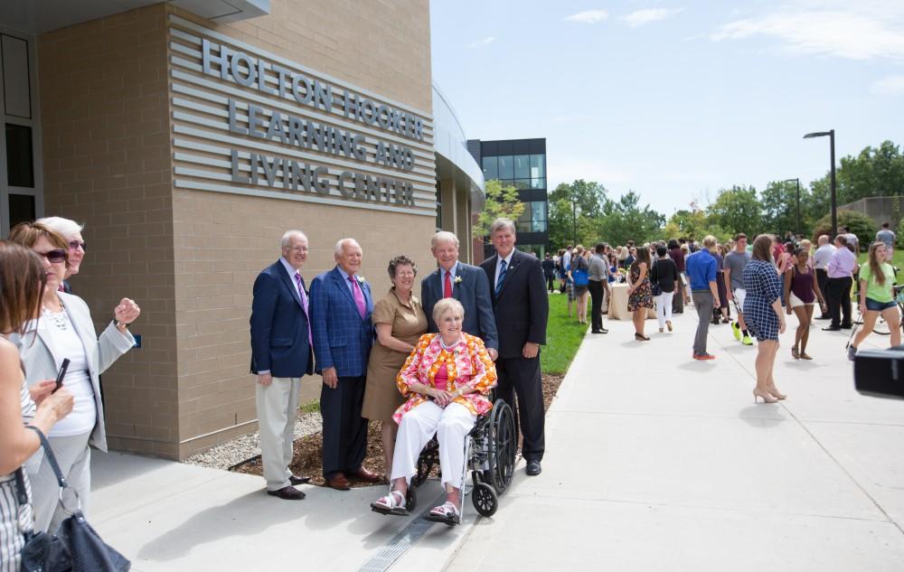 GVL/Kevin Sielaff - President Thomas Haas (right) and John Kennedy (left) stand with the Holton and Hooker families in front of the Holton-Hooker Learning and Living Center on Friday, August 26, 2016.   