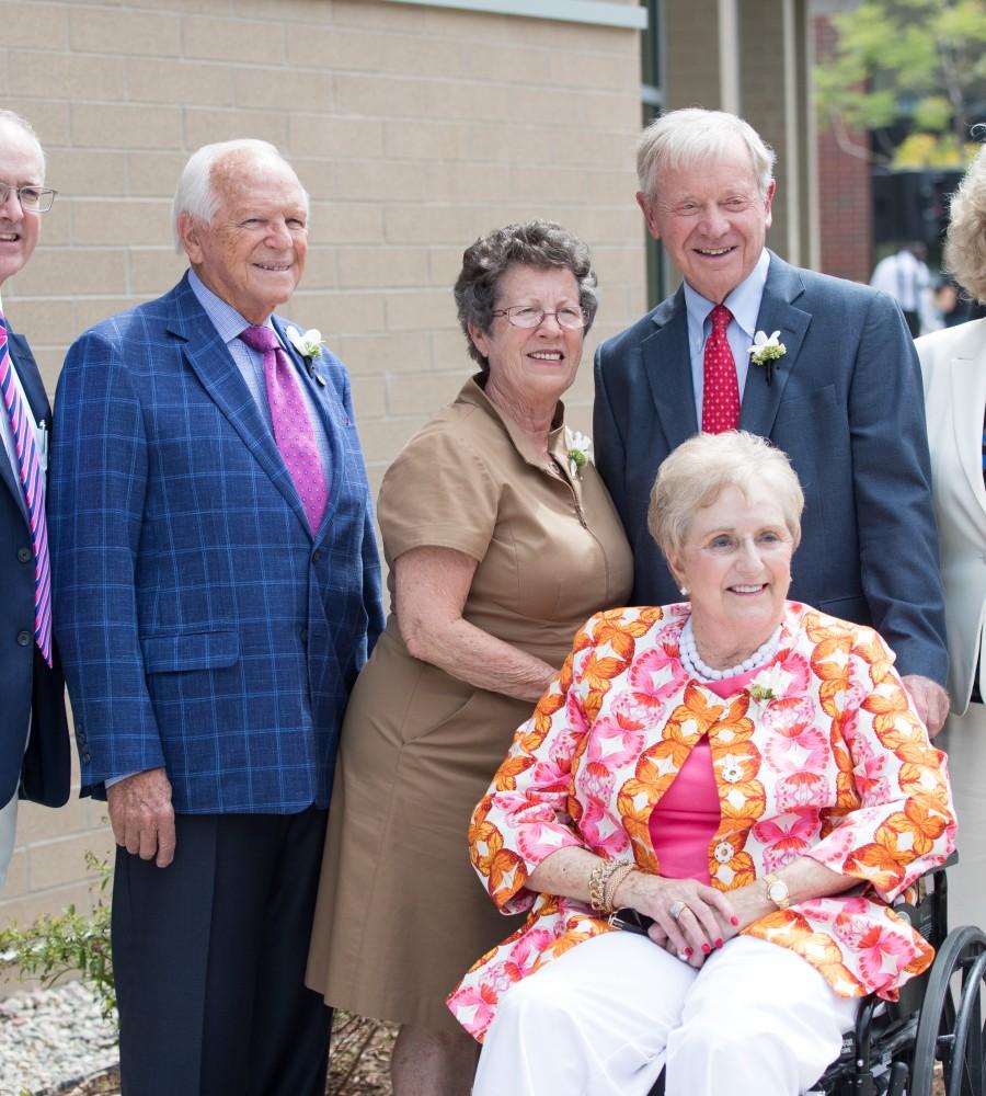 GVL/Kevin Sielaff - Earl and Donnalee Holton (left) stand beside Bob and Judy Hooker (right) in front of the Holton-Hooker Learning and Living Center on Friday, August 26, 2016.    