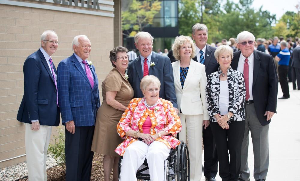 GVL/Kevin Sielaff - Earl and Donnalee Holton (left) stand beside Bob and Judy Hooker (right) in front of the Holton-Hooker Learning and Living Center on Friday, August 26, 2016.    