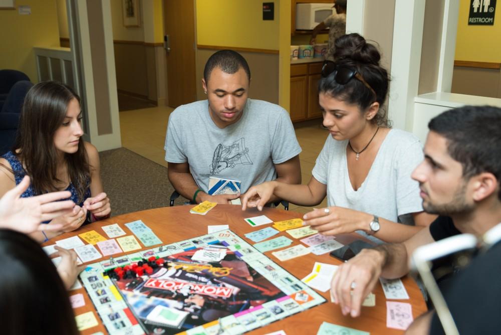 GVL / Luke Holmes - International students play Monopoly in the Murray International House.