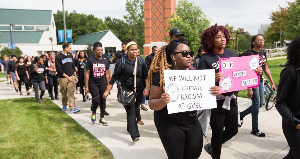 GVL/Kevin Sielaff - Grand Valley's NAACP chapter holds a campus wide demonstration in protest of police brutality Friday, Sept. 23, 2016 in Allendale.