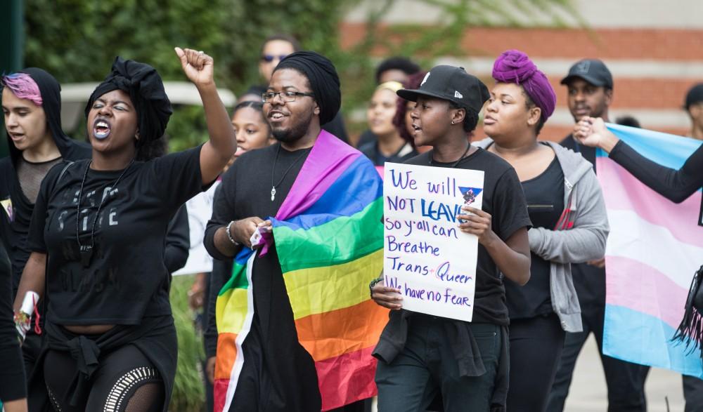 GVL/Kevin Sielaff - Ezra Smith participates in the protest. Grand Valley's NAACP chapter holds a campus wide demonstration in protest of police brutality Friday, Sept. 23, 2016 in Allendale.