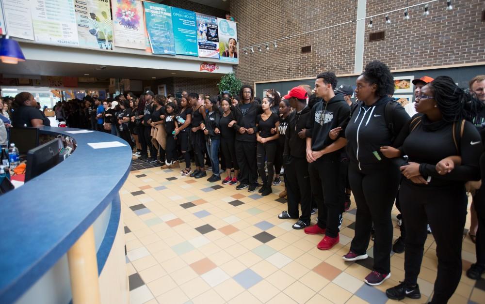 GVL/Kevin Sielaff - Demonstrators gather within the Kirkhof Center for ten minutes of silence. Grand Valley's NAACP chapter holds a campus wide demonstration in protest of police brutality Friday, Sept. 23, 2016 in Allendale.