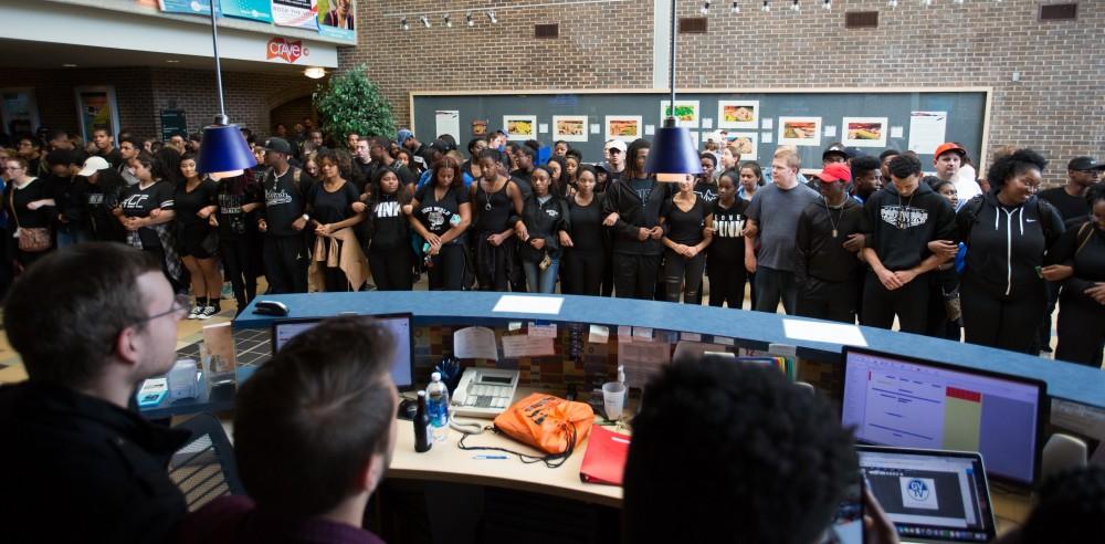 GVL/Kevin Sielaff - Demonstrators gather within the Kirkhof Center for ten minutes of silence. Grand Valley's NAACP chapter holds a campus wide demonstration in protest of police brutality Friday, Sept. 23, 2016 in Allendale.