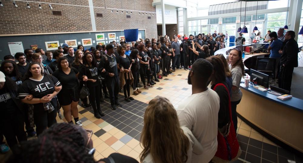 GVL/Kevin Sielaff - Demonstrators gather within the Kirkhof Center for ten minutes of silence. Grand Valley's NAACP chapter holds a campus wide demonstration in protest of police brutality Friday, Sept. 23, 2016 in Allendale.