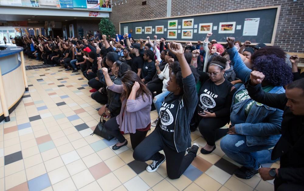 GVL/Kevin Sielaff - Demonstrators gather within the Kirkhof Center for ten minutes of silence. Grand Valley's NAACP chapter holds a campus wide demonstration in protest of police brutality Friday, Sept. 23, 2016 in Allendale.