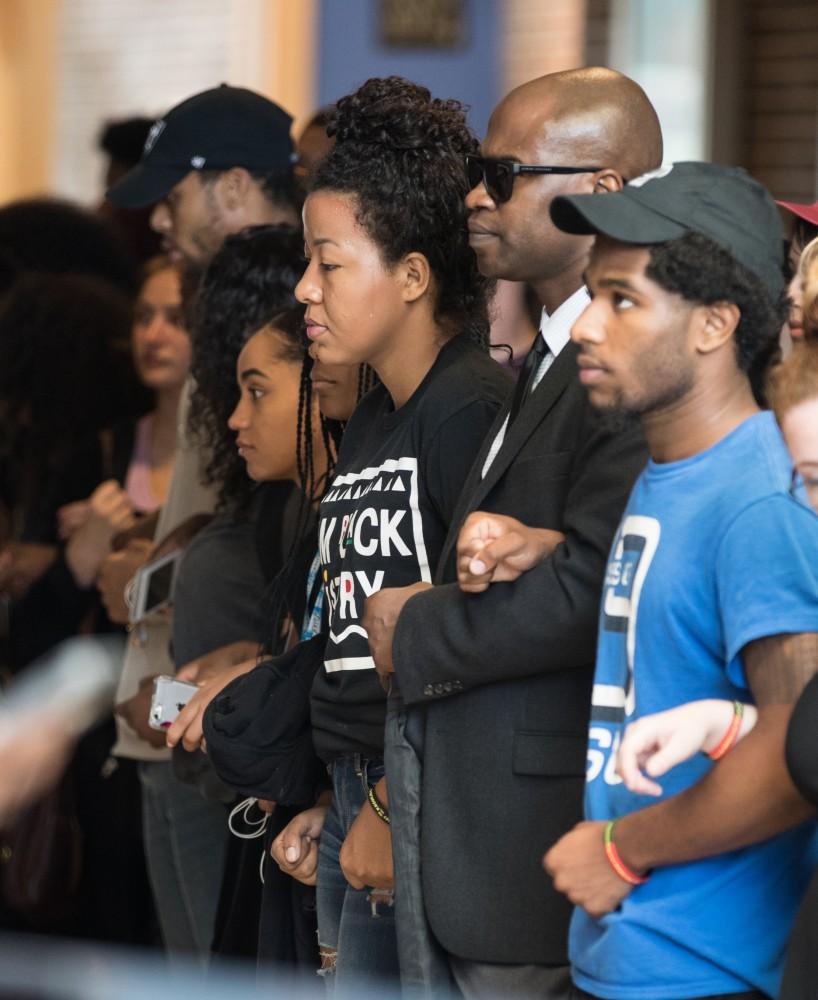 GVL/Kevin Sielaff - Demonstrators gather within the Kirkhof Center for ten minutes of silence. Grand Valley's NAACP chapter holds a campus wide demonstration in protest of police brutality Friday, Sept. 23, 2016 in Allendale.