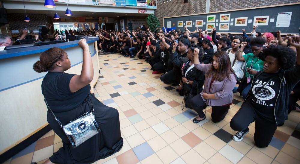 GVL/Kevin Sielaff - Demonstrators gather within the Kirkhof Center for ten minutes of silence. Grand Valley's NAACP chapter holds a campus wide demonstration in protest of police brutality Friday, Sept. 23, 2016 in Allendale.