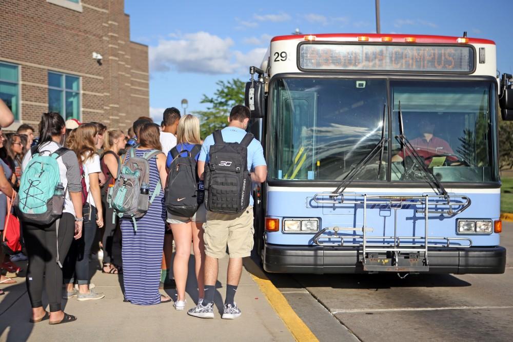 GVL / Emily Frye
Grand Valley students wait at the Kirkhof bus stop after classes on Aug. 31, 2016.