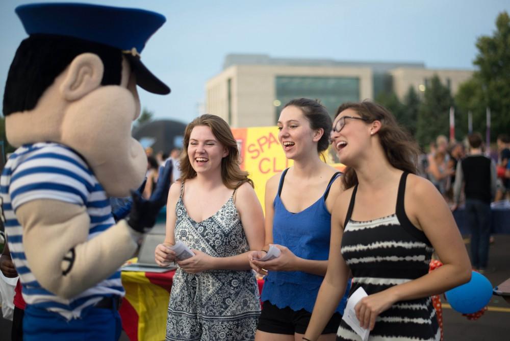 GVL / Luke Holmes - Students from the Spanish Club talk to Louie the Laker during Campus Life Night. Campus Night Life was held in the Parking Lot H on Tuesday, Sep. 6, 2016.