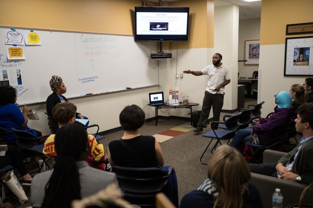 GVL/Kevin Sielaff - ReChard Peel speaks inside the Office of Multicultural Affairs Wednesday, Sept. 21, 2016 as part of Conversations of Color.