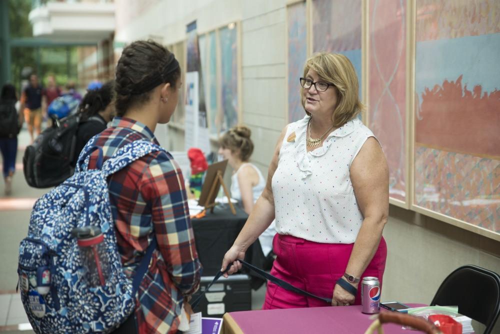 GVL / Luke Holmes - Becky Baker talks to a student about internship opportunities. The Volunteer/Non-Profit Internship Fair was held in Henry Hall on Thursday, Sep. 8, 2016.