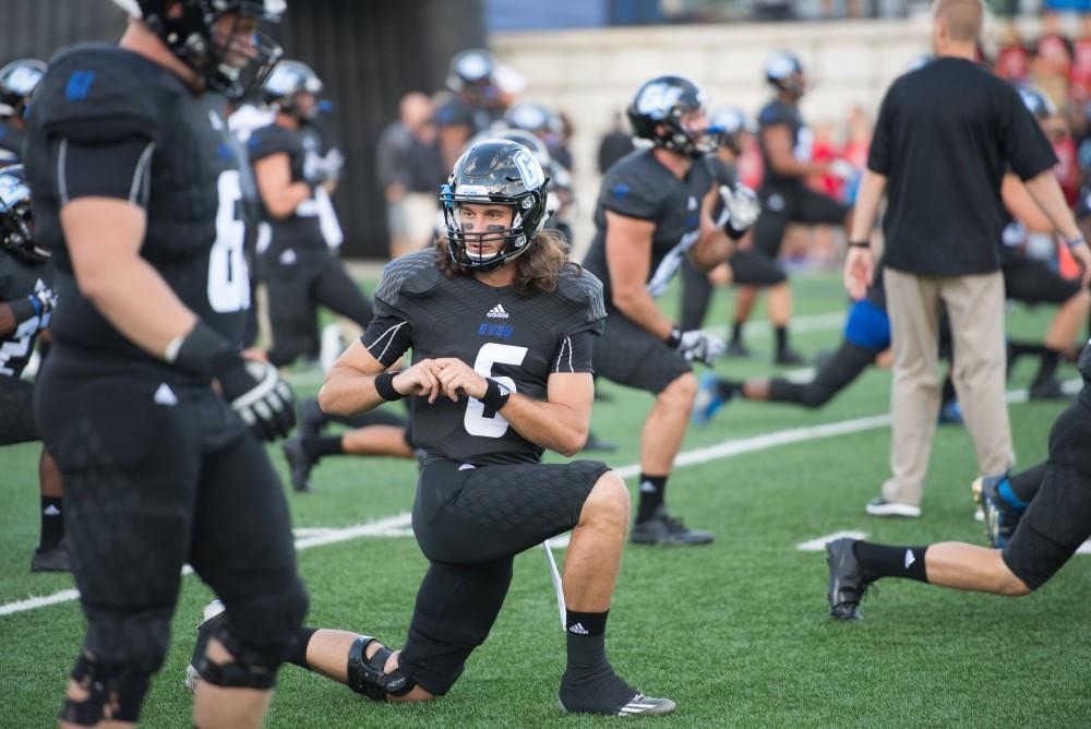 GVL / Luke Holmes - Bart Williams (6) warms up on the field. GVSU defeated Lake Erie College 55-7 on Saturday, Sep. 10, 2016.