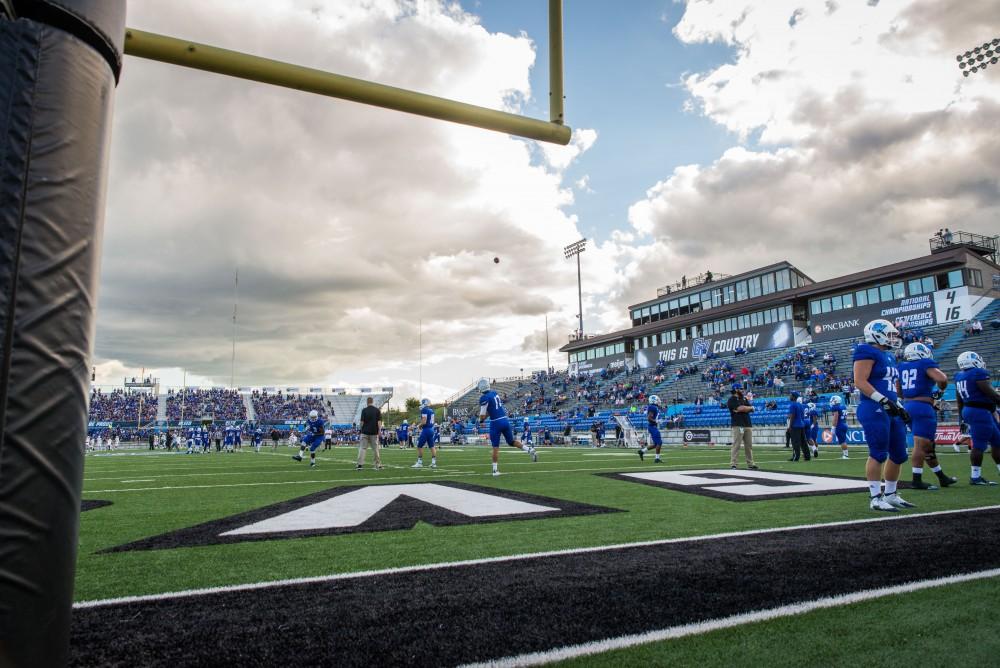 GVL / Luke Holmes - Jacari Faulkner (52) runs out onto the field. GVSU defeated Northern Michigan University 50-24 in Lubber's Stadium on Saturday, Sept. 17, 2016.