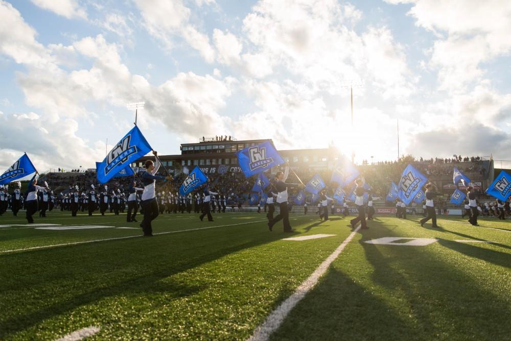 GVL / Luke Holmes - Sydney Omameh (3) tackles the quarterback. GVSU defeated Northern Michigan University 50-24 in Lubber's Stadium on Saturday, Sept. 17, 2016.