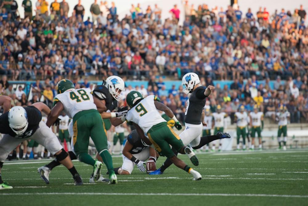 GVL / Luke Holmes - Joel Schipper (19) kicks the field goal. GVSU defeated Northern Michigan University 50-24 in Lubber's Stadium on Saturday, Sept. 17, 2016.