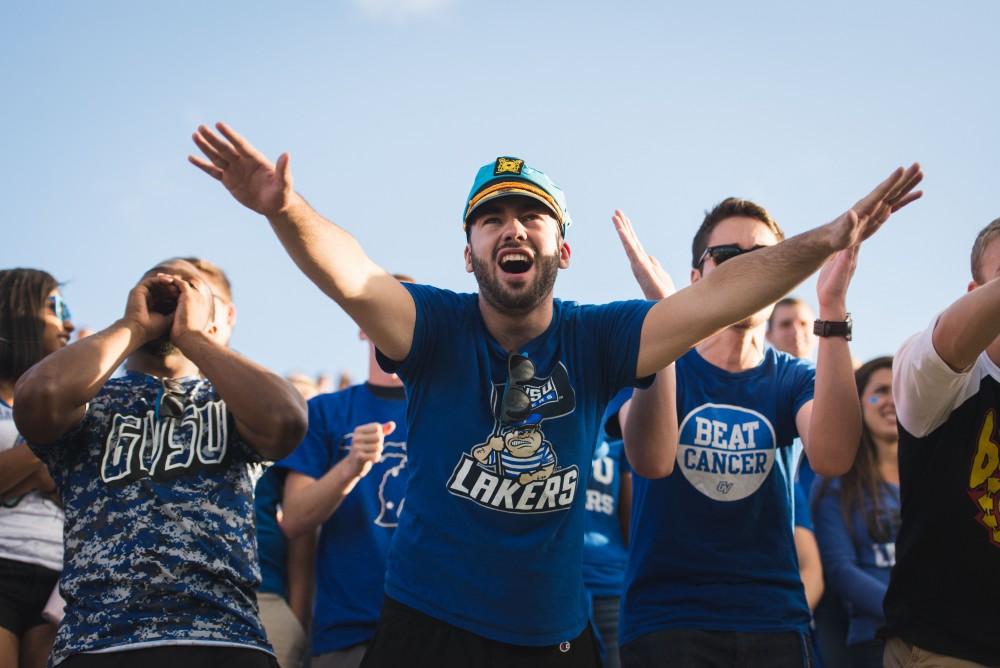 GVL / Luke Holmes - Laker fans yell from the student section. Grand Valley State University defeated Tiffin 45-7 on Thursday, Sep. 1, 2016.