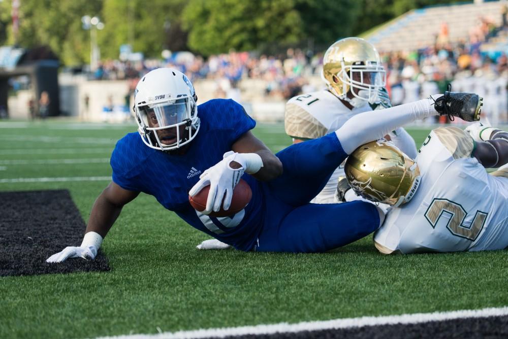 GVL / Luke Holmes - Urston Smith (10) scores the touchdown. Grand Valley State University defeated Tiffin 45-7 on Thursday, Sep. 1, 2016.