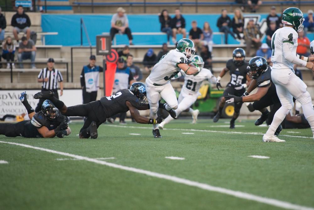 GVL / Luke Holmes - Marquez Gollman (2) attempts to make the tackle. GVSU defeated Lake Erie College 55-7 on Saturday, Sep. 10, 2016.