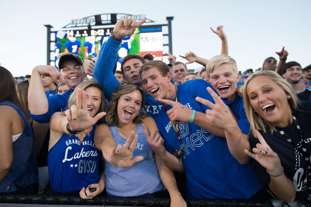 GVL / Luke Holmes - Brandon Bean (3) celebrates after scoring a touchdown. GVSU defeated Northern Michigan University 50-24 in Lubber's Stadium on Saturday, Sept. 17, 2016.