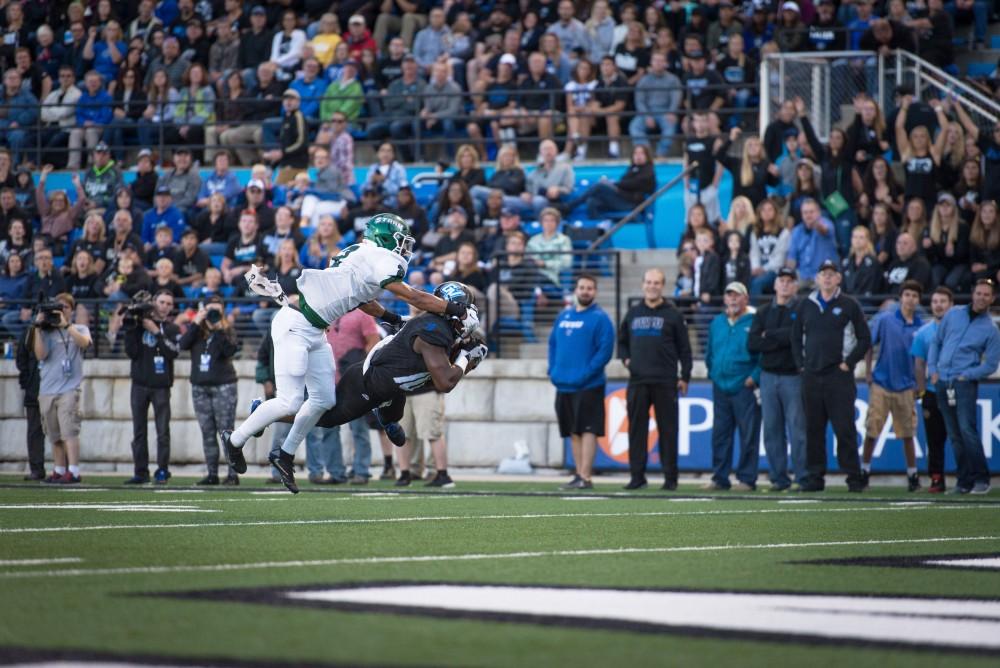 GVL / Luke Holmes - Bart Williams (6) and Nick Dodson (11) jump into each other after scoring the touchdown. Grand Valley State University defeated Tiffin 45-7 on Thursday, Sep. 1, 2016.