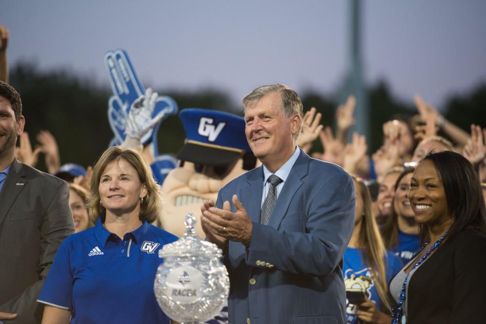 GVL / Luke Holmes - Fans in the student section throw up the anchor hand signal. GVSU defeated Lake Erie College 55-7 on Saturday, Sep. 10, 2016.