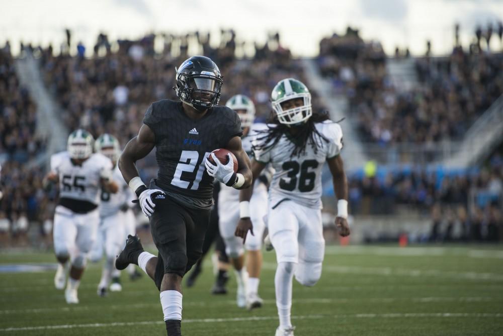 GVL / Luke Holmes - Marty Carter (21) runs in the touchdown.