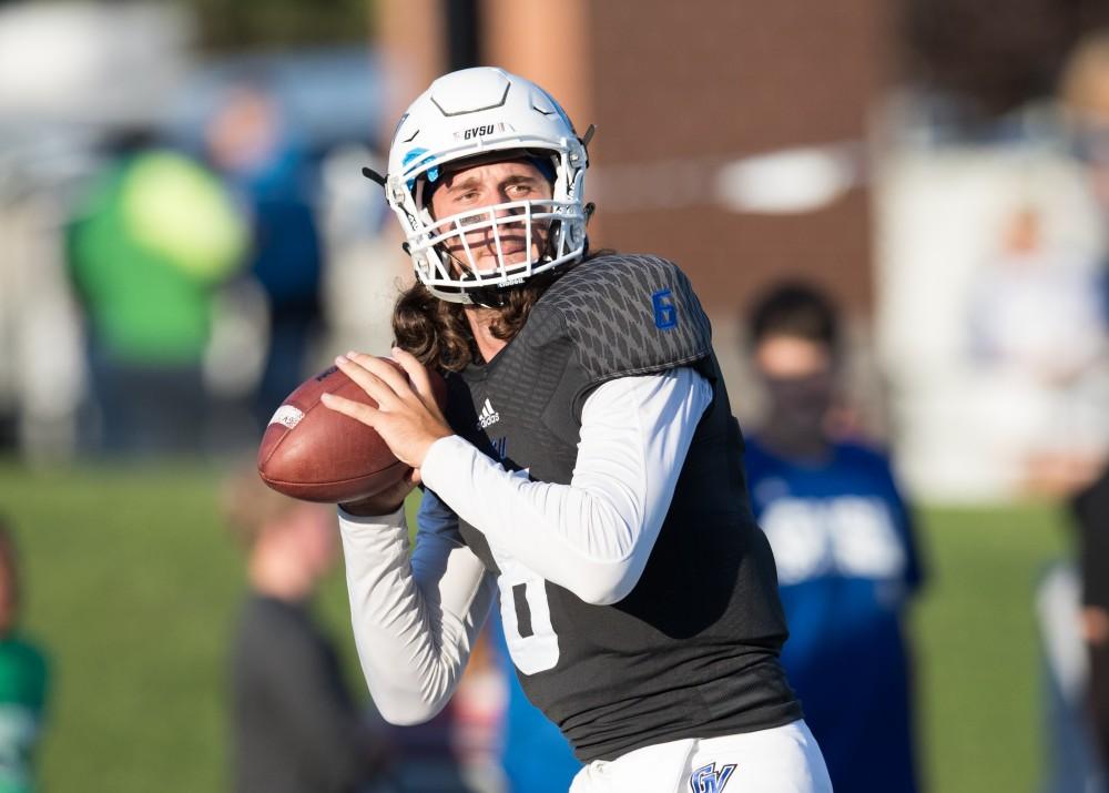 GVL/Kevin Sielaff - Bart Williams (6) warms up before the match. The Lakers defeat the Wildcats of Northern Michigan with a final score of 50-24 on Saturday, Sept. 17, 2016 in Allendale.