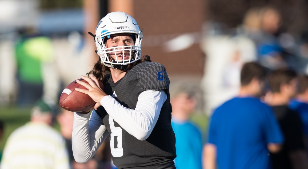 GVL/Kevin Sielaff - Bart Williams (6) warms up before the match. The Lakers defeat the Wildcats of Northern Michigan with a final score of 50-24 on Saturday, Sept. 17, 2016 in Allendale.