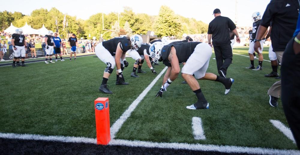 GVL/Kevin Sielaff - Alton Voss (4) warms up before the match. The Lakers defeat the Wildcats of Northern Michigan with a final score of 50-24 on Saturday, Sept. 17, 2016 in Allendale.