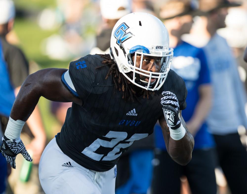 GVL/Kevin Sielaff - Terrell Dorsey (22) warms up before the match. The Lakers defeat the Wildcats of Northern Michigan with a final score of 50-24 on Saturday, Sept. 17, 2016 in Allendale.