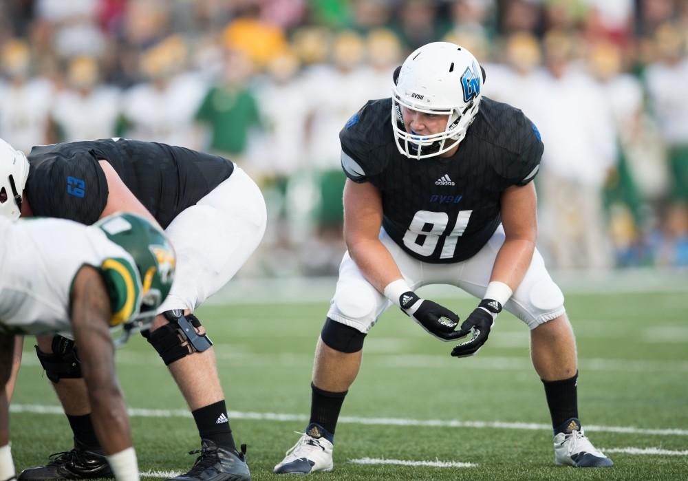 GVL/Kevin Sielaff - Pete Cender (81) sets himself up to defend a Laker field goal attempt. The Lakers defeat the Wildcats of Northern Michigan with a final score of 50-24 on Saturday, Sept. 17, 2016 in Allendale.