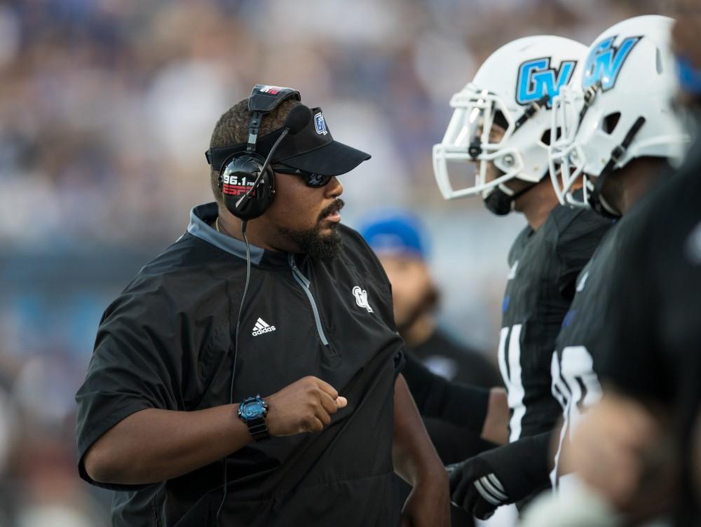 GVL/Kevin Sielaff - Defensive line coordinator E.J. Whitlow speaks with the defensive line on the sideline. The Lakers defeat the Wildcats of Northern Michigan with a final score of 50-24 on Saturday, Sept. 17, 2016 in Allendale.