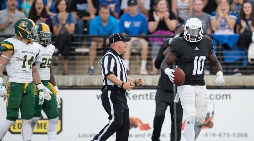 GVL/Kevin Sielaff - Urston Smith (10) celebrates a long reception. The Lakers defeat the Wildcats of Northern Michigan with a final score of 50-24 on Saturday, Sept. 17, 2016 in Allendale.