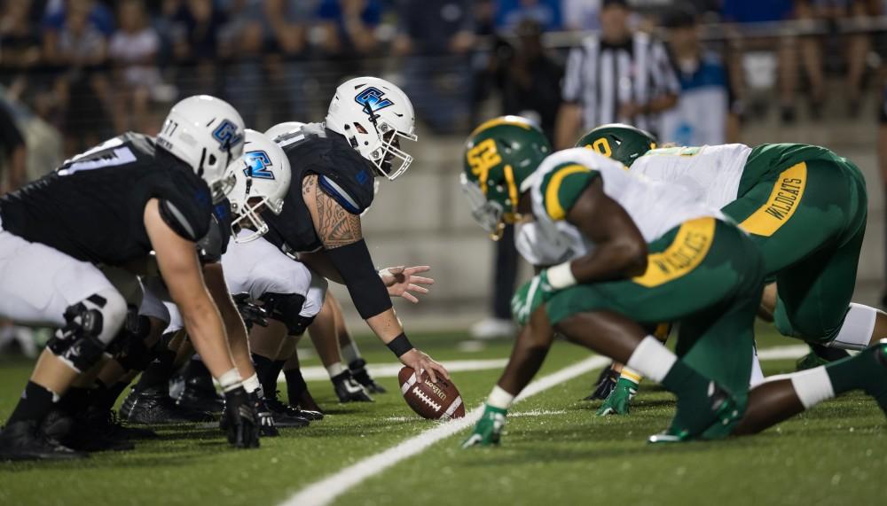 GVL/Kevin Sielaff - Aaron Cox (51) sets himself up on the line of scrimmage. The Lakers defeat the Wildcats of Northern Michigan with a final score of 50-24 on Saturday, Sept. 17, 2016 in Allendale.