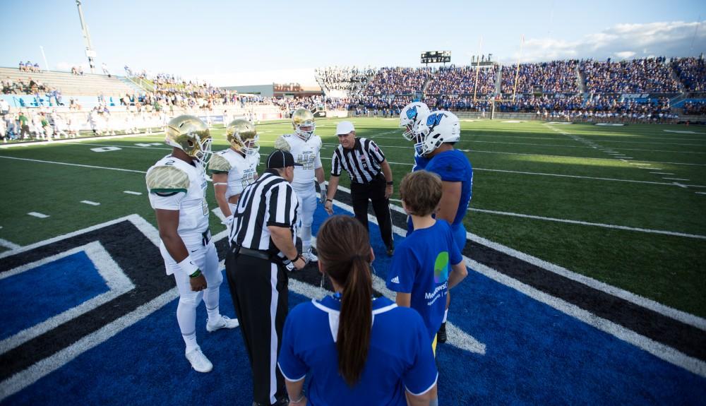 GVL/Kevin Sielaff - Grand Valley and Tiffin meet at center field for the coin toss. Grand Valley defeats Tiffin with a final score of 45-7 on Thursday, September 1, 2016 at Lubbers Stadium.