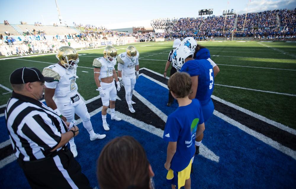 GVL/Kevin Sielaff - Grand Valley and Tiffin meet at center field for the coin toss. Grand Valley defeats Tiffin with a final score of 45-7 on Thursday, September 1, 2016 at Lubbers Stadium.